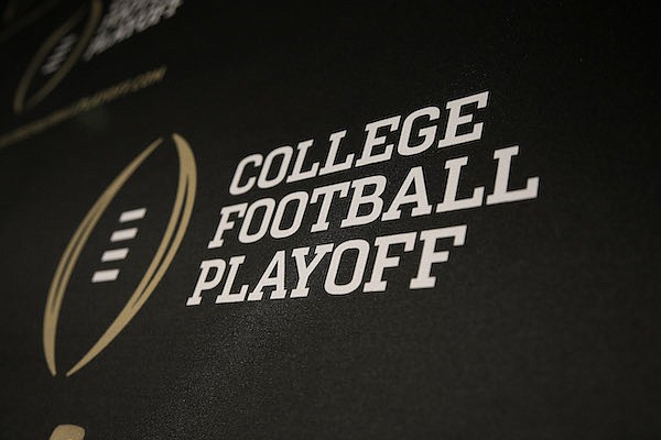 The College Football Playoff logo is printed across a backdrop used during a news conference where the 13 members of the committee were announced, Wednesday, Oct. 16, 2013, in Irving, Texas. (AP Photo/Tony Gutierrez)