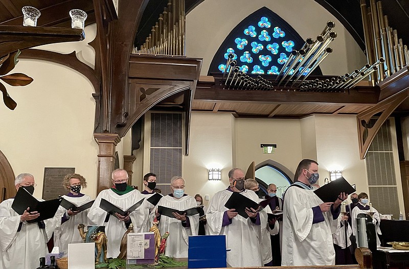 The choir at Trinity Episcopal Cathedral in Little Rock sings during a Christmas Lessons and Carols service on Dec. 19, 2021.