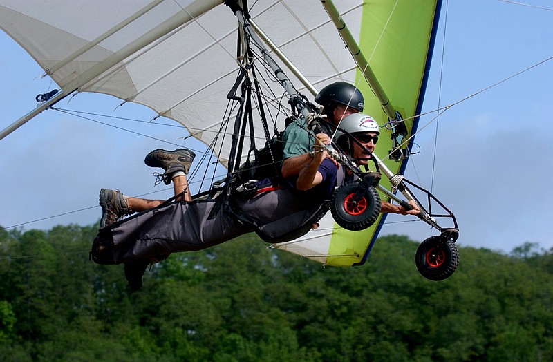 Arkansas Democrat-Gazette/ BETH HALL.Curt Warren of Venice, Fla flies tandem with Buddy Gough.Saturday morning at Byrd's Adventure Center near Cass..for 0617 for nw outdoors..6/12/04