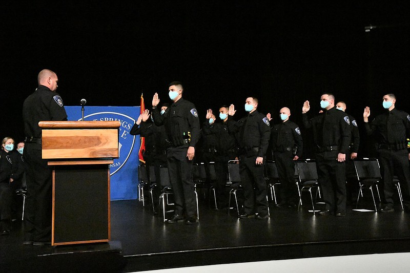 Hot Springs Police Chief Chris Chapmond swears in 11 new officers during a badge pinning ceremony Friday, Jan. 7, at Horner Hall in the Hot Springs Convention Center. - File photo by The Sentinel-Record