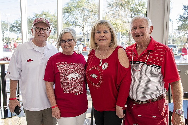 Tombo and Debbie Watts of El Dorado and Doris and Bill Lawrence of Russellville at the Outback Bowl Pre Game Party at Raymond James Stadium, Tampa, Fla., on Jan. 1, 2022. (Arkansas Democrat-Gazette)