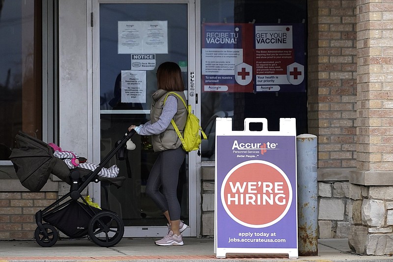 A hiring sign is posted last month outside an employment agency in Buffalo Grove, Ill.
(AP/Nam Y. Huh)