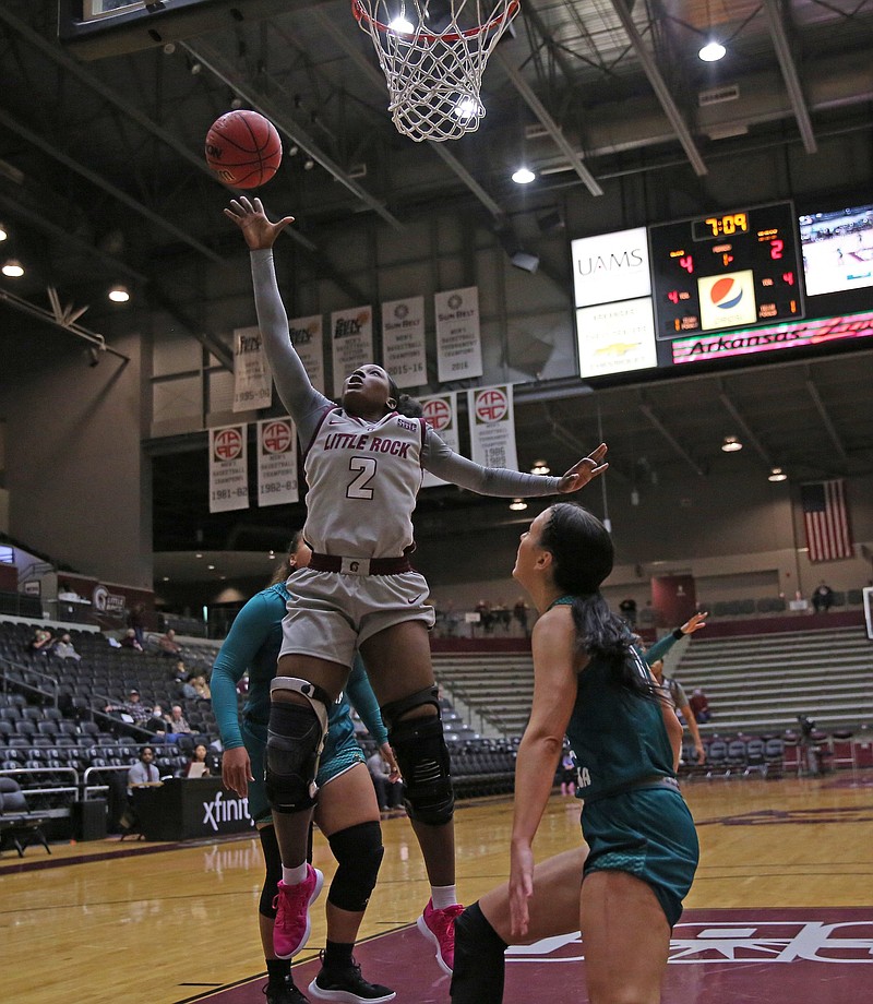 UALR’s Sali Kourouma drives to the basket during the Trojans’ victory over Coastal Carolina on Thursday at the Jack Stephens Center in Little Rock. Kourouma led all scorers with 23 points. More photos available at arkansasonline.com/114ccuualr.
(Arkansas Democrat-Gazette/Colin Murphey)