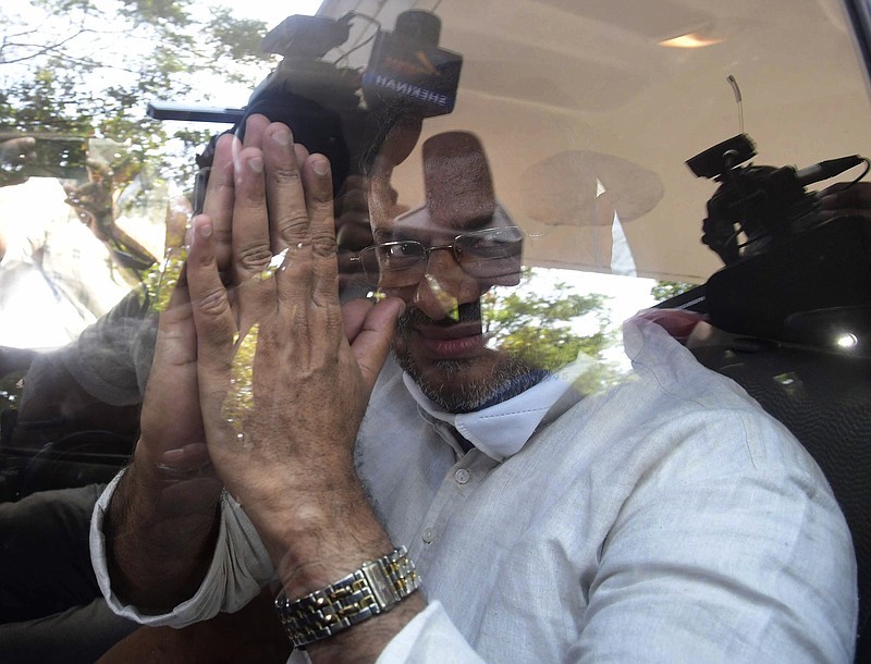 Bishop Franco Mulakkal acknowledges the media Friday as he leaves court in Kottayam, India.
(AP)