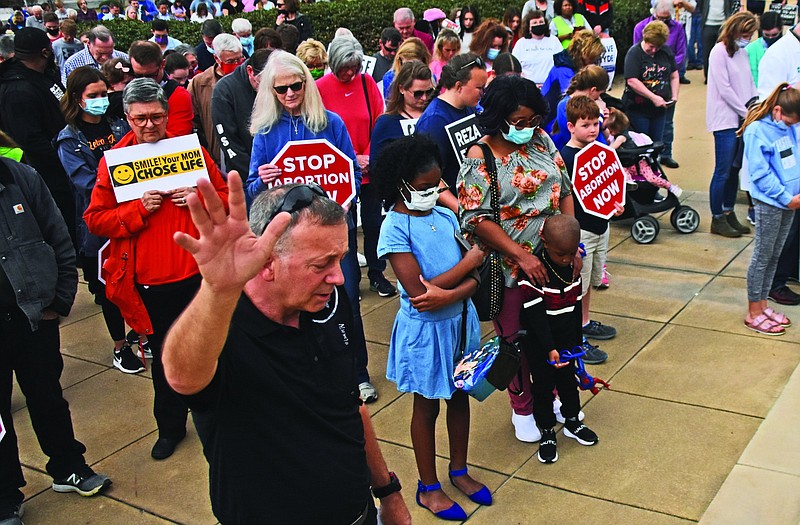 Participants in last year’s March for Life paused for prayer during a rally on the steps of the state Capitol. Catholics will hold a Eucharistic procession as well as a Mass for Life prior to this year’s march.
(Arkansas Democrat-Gazette/Staci Vandagriff)