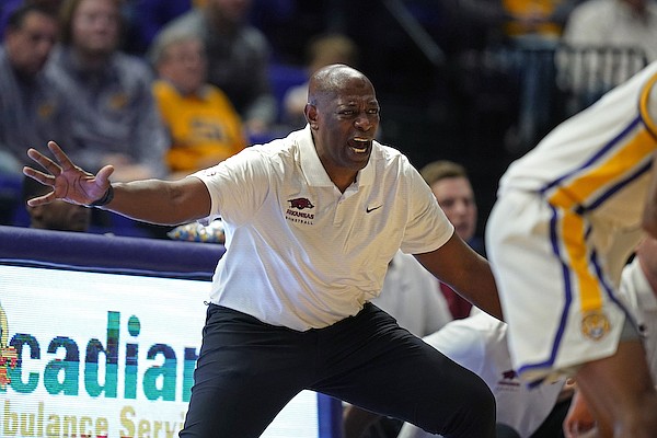 Arkansas interim head coach Keith Smart calls out forth bench in the first half of an NCAA college basketball game against LSU in Baton Rouge, La., Saturday, Jan. 15, 2022. (AP Photo/Gerald Herbert)