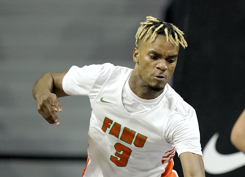 Florida A&M's MJ Randolph is shown during a basketball game in Manhattan, Kan., in this Nov. 10, 2021, file photo. Against the University of Arkansas at Pine Bluff men’s basketball team on Saturday, Jan. 15, 2022, Randolph finished with 25 points, including 4 of the Rattlers' 8 points in overtime. (AP/Charlie Riedel)