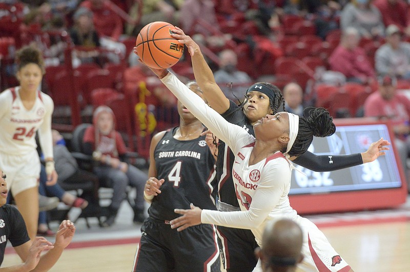 Arkansas? Makayla Daniels gets her shot blocked by South Carolina?s Laeticia Amihere Sunday Jan. 16, 2022 at Bud Walton Arena in Fayetteville. Arkansas lost 52-61. Visit nwaonline.com/220117Daily/ for today's photo gallery.  (NWA Democrat-Gazette/J.T. Wampler)