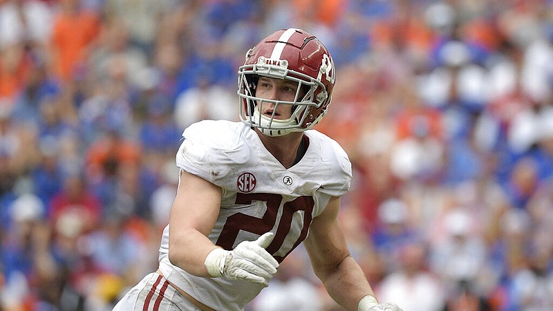 Alabama linebacker Drew Sanders (20) follows a play during the second half of an NCAA college football game against Florida, Saturday, Sept. 18, 2021, in Gainesville, Fla. (AP Photo/Phelan M. Ebenhack)