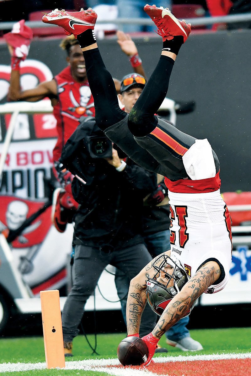 Buccaneers wide receiver Mike Evans celebrates after his touchdown reception during Sunday’s game against the Eagles in Tampa, Fla. (Associated Press)