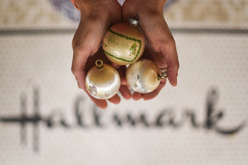 Carrie Tergin displays her favorite Christmas ornaments.