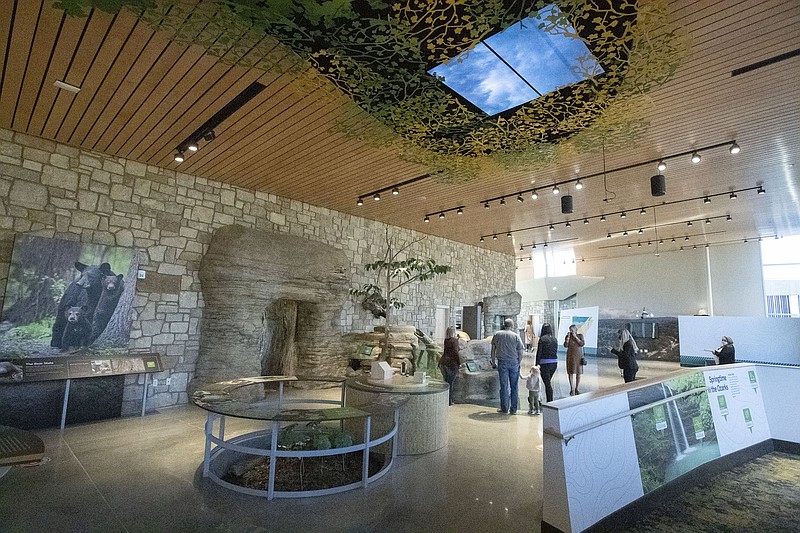 FILE — Guests look at displays Thursday Dec. 10, 2020 during ribbon cutting ceremony for the Arkansas Game and Fish Commissionâ€™s J.B. and Johnelle Hunt Family Ozark Highlands Nature Center in Springdale. (NWA Democrat-Gazette/J.T. Wampler)