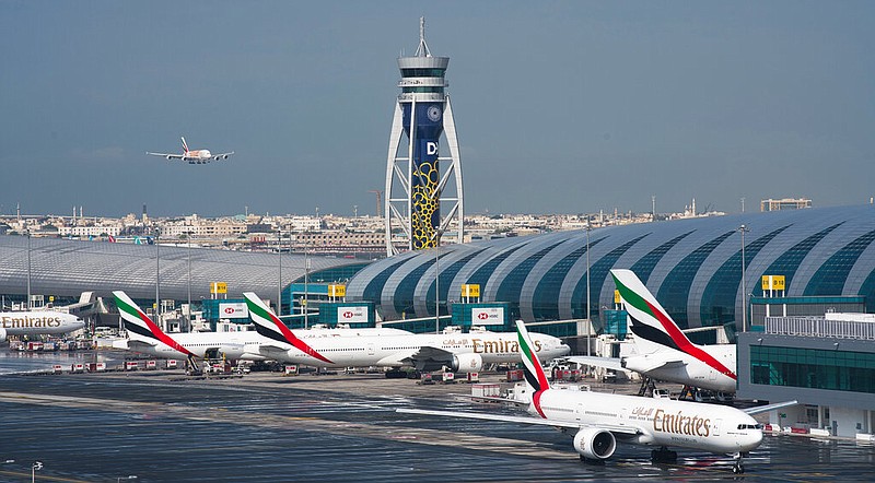 FILE - An Emirates jetliner comes in for landing at the Dubai International Airport in Dubai, United Arab Emirates, Dec. 11, 2019. (AP/Jon Gambrell, File)