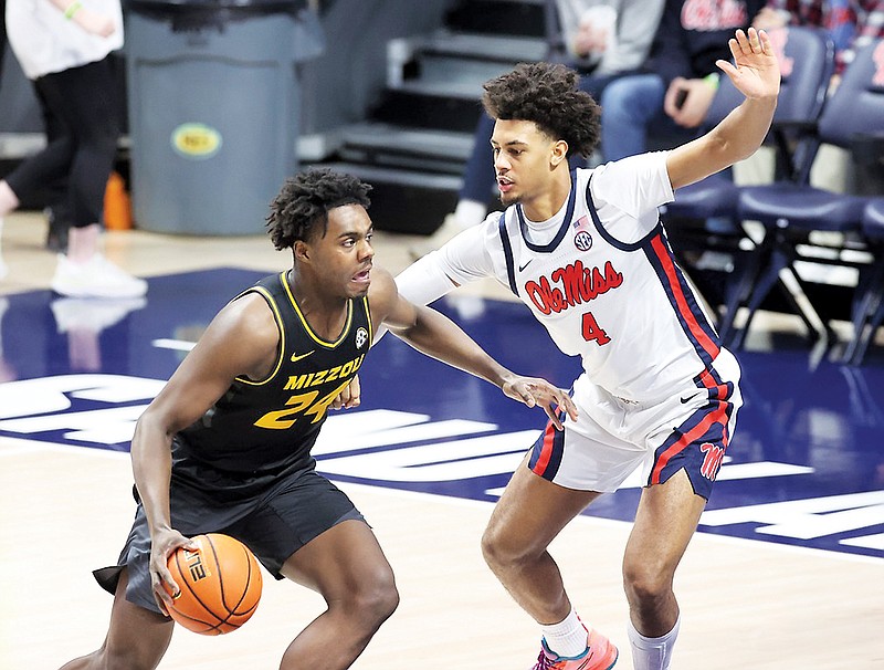 Kobe Brown of Missouri tries to drive against the defense of Mississippi’s Jaemyn Brakefield during Tuesday night’s game in Oxford, Miss. (Photo by Joshua McCoy/Ole Miss Athletics)