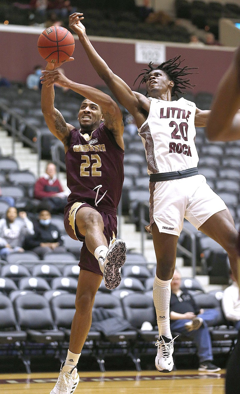 UALR’s Kevin Osawe (right) goes up for a rebound with Texas State’s Nighael Ceaser during the first half of the Trojans’ 69-59 loss Thursday night at the Jack Stephens Center in Little Rock. More photos at arkansasonline.com/121ualrtsu/
(Arkansas Democrat-Gazette/Thomas Metthe)