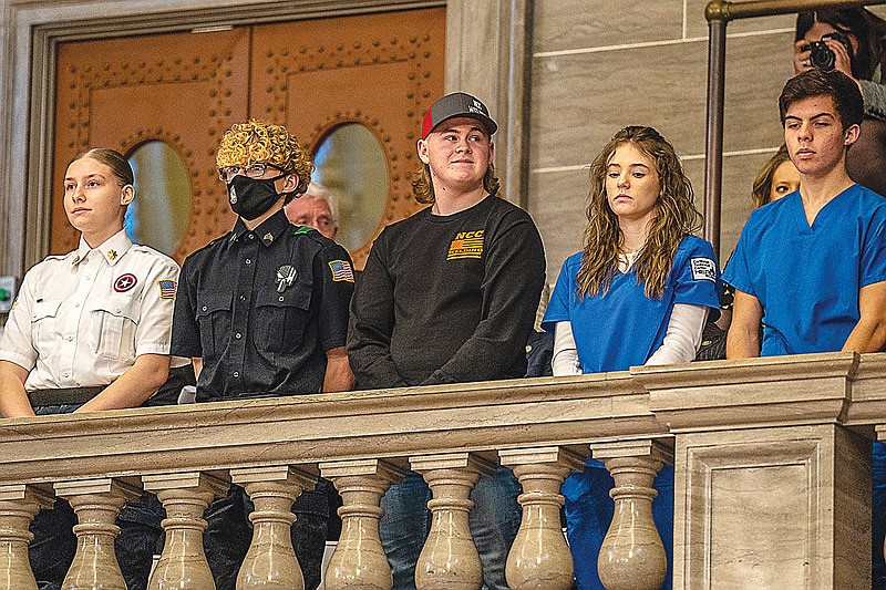 Cody Elliot, third from left, stands as he and other Missouri students are honored by Gov. Mike Parson during his annual State of the State Address on Wednesday, Jan. 19, 2022, at the Missouri Capitol in Jefferson City. Elliot is a student at Nichols Career Center. (Ethan Weston/News Tribune photo)