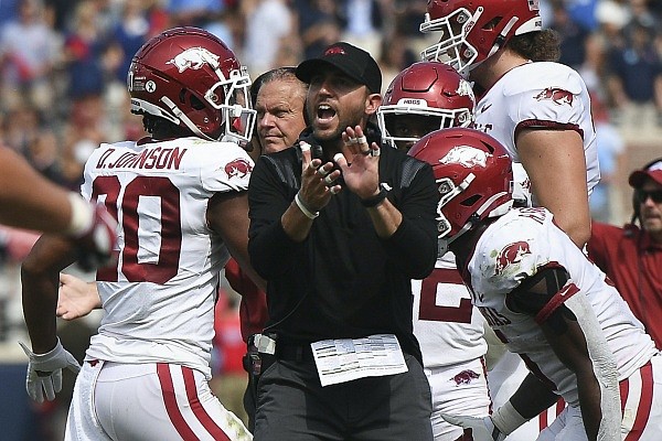 Arkansas offensive coordinator Kendal Briles claps during a game against Ole Miss on Saturday, Oct. 9, 2021, in Oxford, Miss.