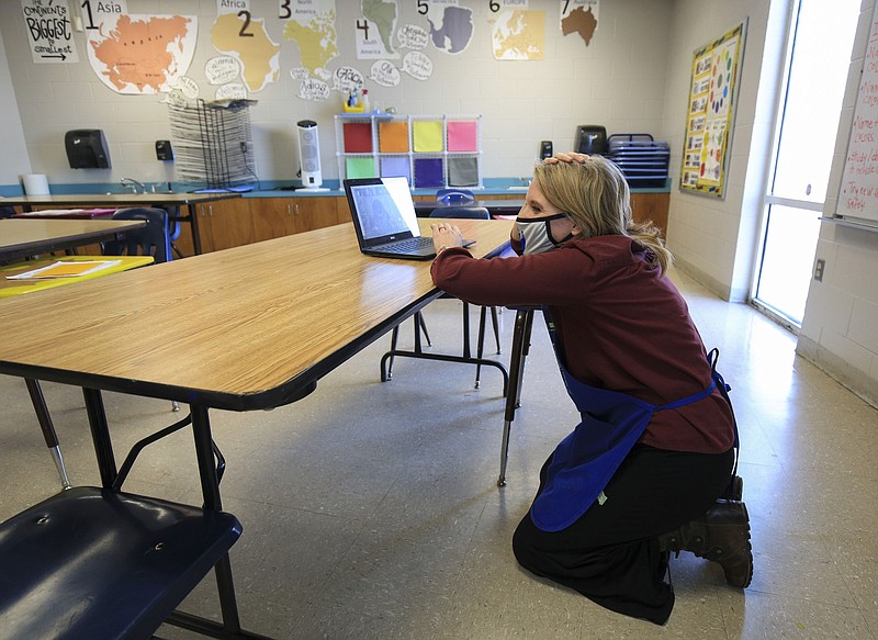 Stephanie Crowell, an art teacher at Carvel Elementary School in the Little Rock School District, answers a question from a student online in this Nov. 18, 2020, file photo. Crowell's in-person students left the classroom because of the coronavirus pandemic. (Arkansas Democrat-Gazette/Staton Breidenthal)
