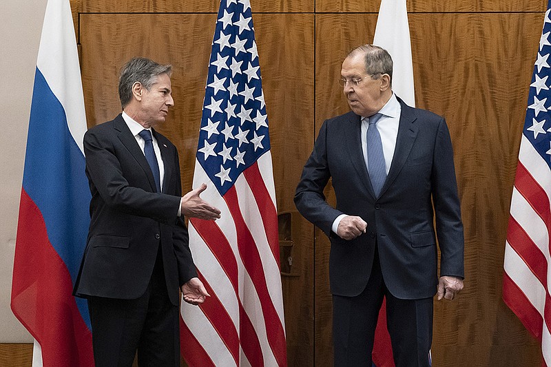 Secretary of State Antony Blinken (left) and Russian Foreign Minister Sergey Lavrov exchange greetings Friday in Geneva. After the meeting, Blinken said he believed “we are now on a clearer path to understanding each other’s positions.”
(AP/Alex Brandon)