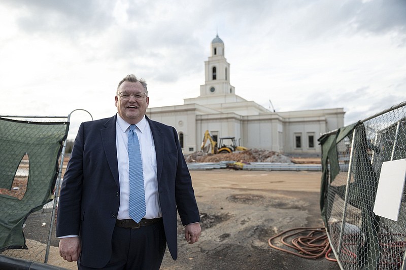 Simon Keogh, president of the Bentonville Stake of The Church of Jesus Christ of Latter-day Saints, stands in front of the temple being built in northeast Bentonville. It is expected to be completed late this year.
(NWA Democrat-Gazette/Spencer Tirey)