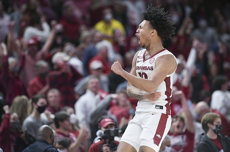 Arkansas sophomore forward Jaylin Williams celebrates after hitting a jumper in overtime during Saturday night’s victory over Texas A&M at Walton Arena in Fayetteville. Williams finished with 14 points, 11 rebounds, a career-high 6 steals, 3 blocks and 3 assists. More photos available at arkansasonline.com/123tamua.
(NWA Democrat-Gazette/Charlie Kaijo)