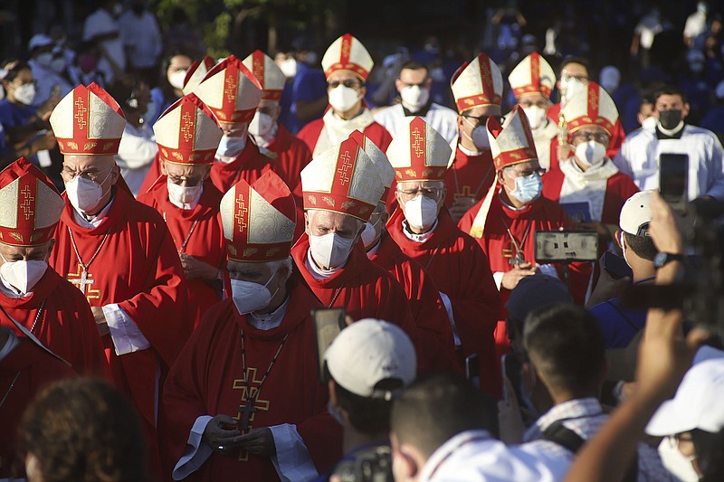 Catholic bishops walk to the main altar Saturday in San Salvador, El Salvador, during a beatification ceremony for two priests and two lay people, all victims of right-wing death squads during El Salvador’s civil war. More photos at arkansasonline.com/123salvador/.
(AP/Salvador Melendez)