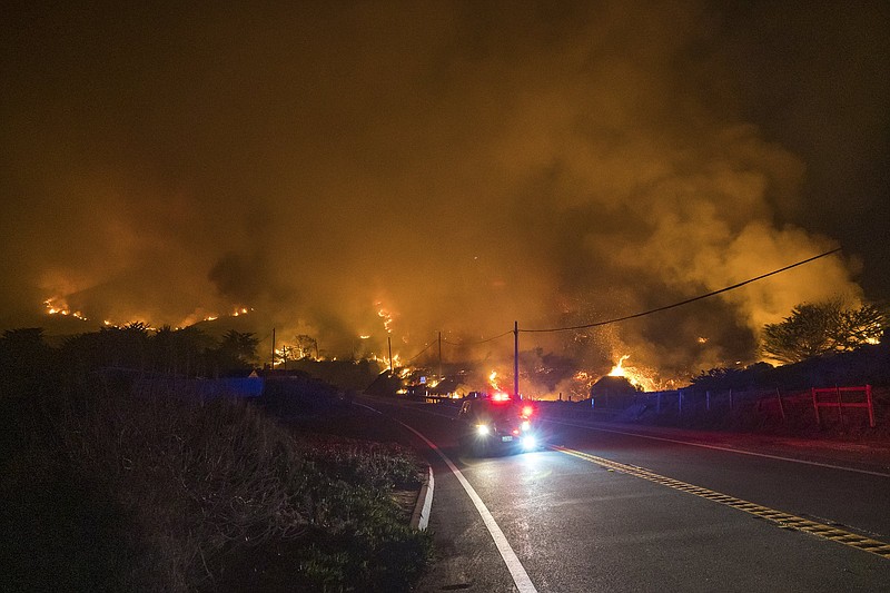 A wildfire rages Saturday along Highway 1 near Big Sur, Calif. More photos at arkansasonline.com/123bigsur/.
(AP/Nic Coury)