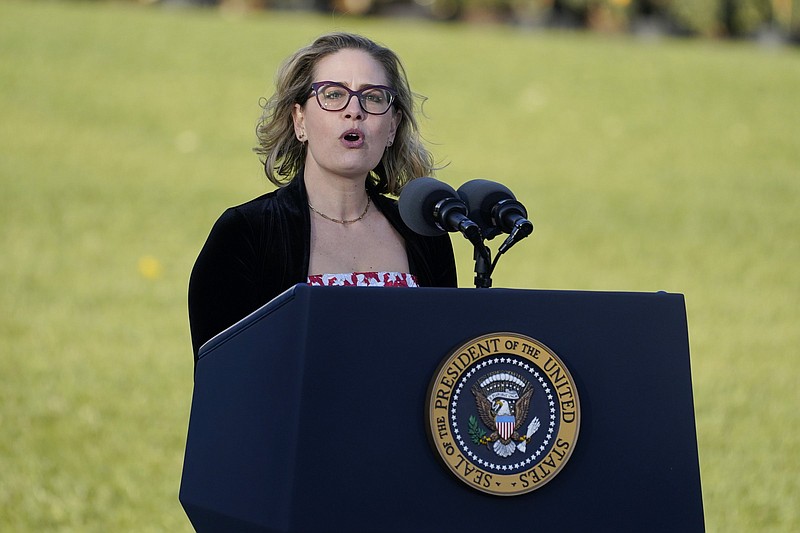 FILE - Sen. Kyrsten Sinema, D-Ariz., speaks before President Joe Biden signs the $1.2 trillion bipartisan infrastructure bill into law during a ceremony on the South Lawn of the White House in Washington, on Nov. 15, 2021. (AP Photo/Evan Vucci, File)