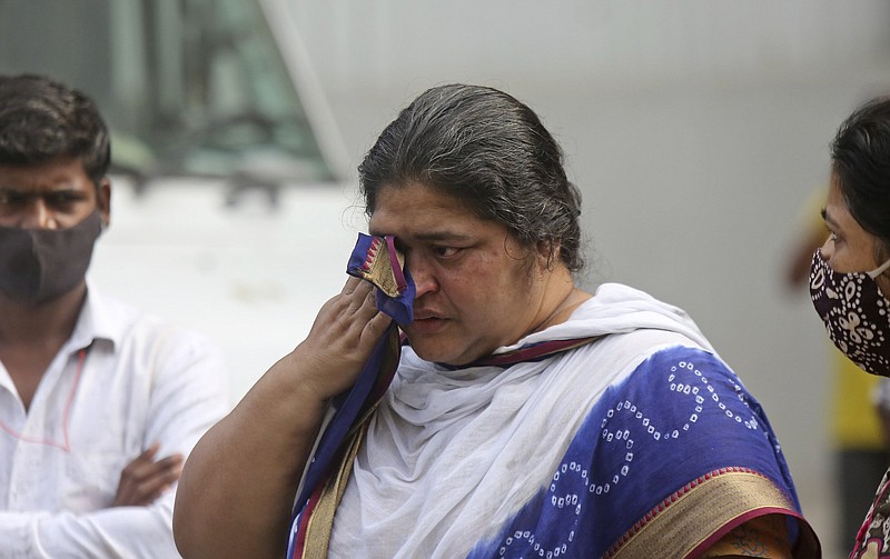 A woman cries Saturday after being evacuated from a building that caught fire in Mumbai, India.
(AP/Emmanual Yogini)