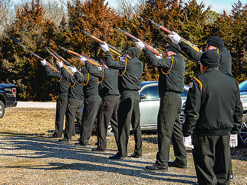 The VFW Honor Guard fires a salute to U.S. Army Specialist Michael Campbell to conclude the dedication ceremony for the signs designating the Michael Campbell Memorial Highway near Brazito Saturday, Jan. 22, 2022.  Campbell was killed in Iraq in 2004.  (Ken Barnes/News Tribune photo)