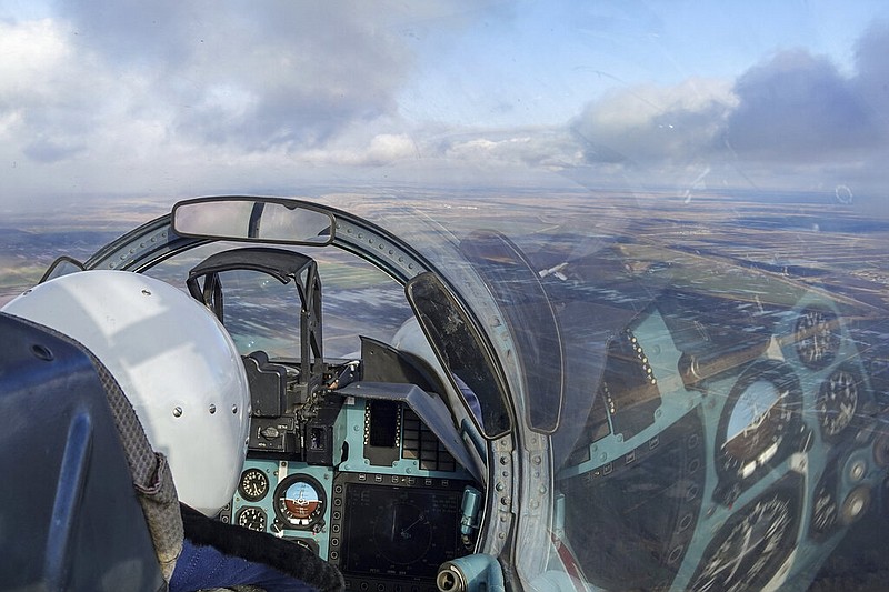 The cockpit of a Russian Su-30 fighter jet is seen as it takes part in a training mission in Krasnodar Region, Russia, on Wednesday, Jan. 19, 2022. With tens of thousands of Russian troops positioned near Ukraine, the Kremlin has kept the U.S. and its allies guessing about its next moves in the worst Russia-West security crisis since the Cold War. (AP/Vitaliy Timkiv)