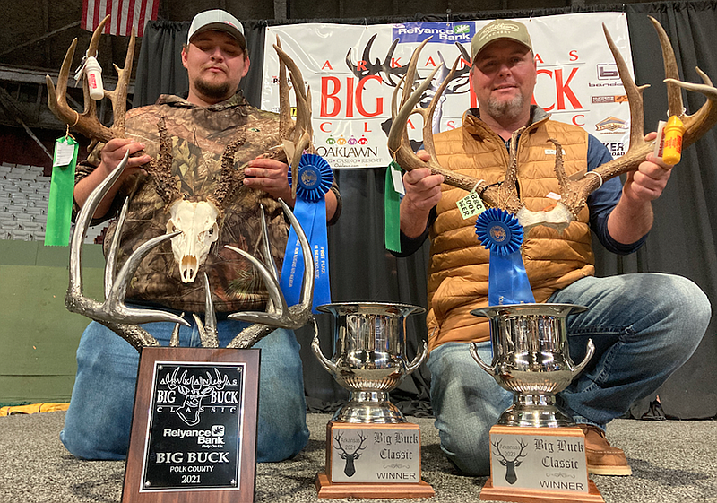 Zack Watts (left) of Mena and Chad Richardson of Fouke won the Best of Show honors for bucks they killed in 2020 and 2021, respectively, at the Arkansas Big Buck Classic on Sunday at Barton Coliseum in Little Rock. (Arkansas Democrat-Gazette/Bryan Hendricks)