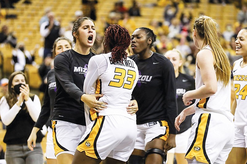 Micah Linthacum (left) celebrates with Missouri teammate Aijha Blackwell during Sunday's game against Texas A&M at Mizzou Arena. (Mizzou Athletics)