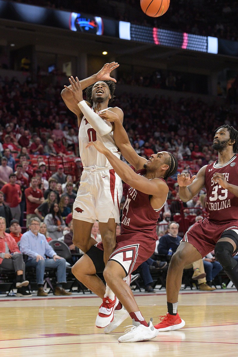 Stanley Umude (0), senior guard for the Arkansas Razorbacks, draws a foul on Tuesday, Jan. 18, 2022, during the second half of the Razorbacks' 75-59 win over South Carolina at Bud Walton Arena in Fayetteville. Visit nwaonline.com/220119Daily/ for today's photo gallery..(NWA Democrat-Gazette/Hank Layton)