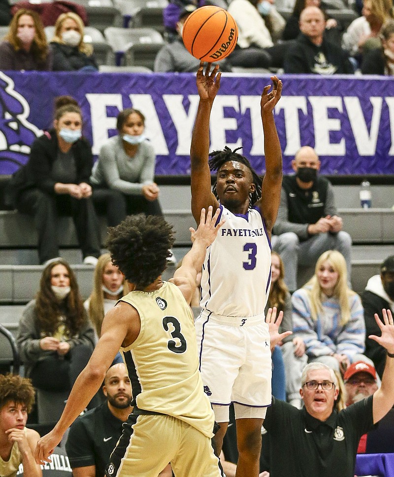 Fayetteville’s Landon Glasper takes a shot over a Bentonville defender Thursday during the Bulldogs’ 75-68 victory over the Tigers at Bulldog Arena in Fayetteville. Glasper finished with 25 points. Visit nwaonline.com/221127Daily/ for today’s photo gallery.
(Special to the NWA Democrat-Gazette/David Beach)