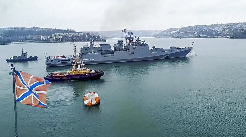 In this photo taken from video and released by the Russian Defense Ministry Press Service on Wednesday, Jan. 26, 2022, the Russian navy's frigate Admiral Essen prepares to sail off for an exercise in the Black Sea. (Russian Defense Ministry Press Service via AP)