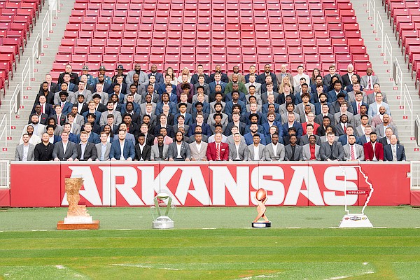 Members of the 2021 Arkansas football team pose for a photo following the regular season.