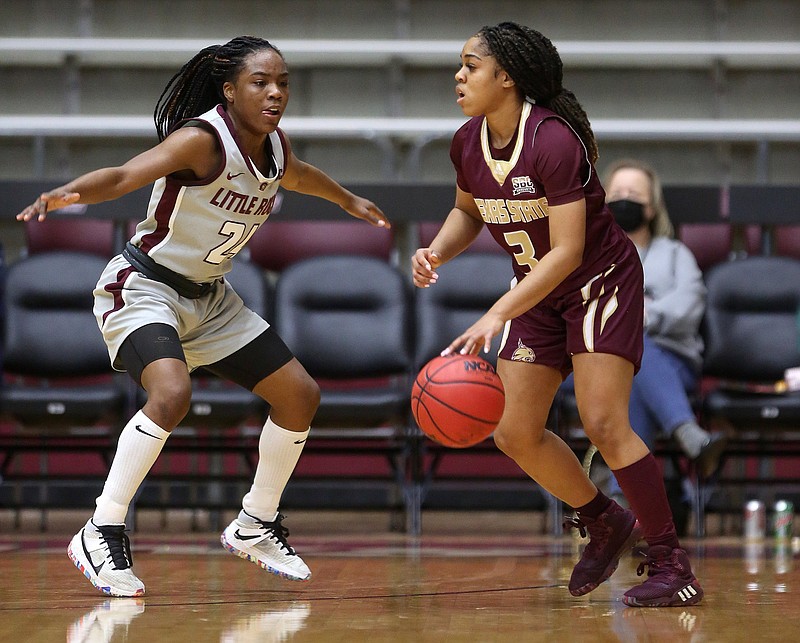 UALR’s Mayra Caicedo (left) defends against Kennedy Taylor of Texas State during Thursday’s game at the Jack Stephens Center in Little Rock. Caicedo had 11 points and seven rebounds. More photos available at arkansasonline.com/128ualr.
(Arkansas Democrat-Gazette/Thomas Metthe)