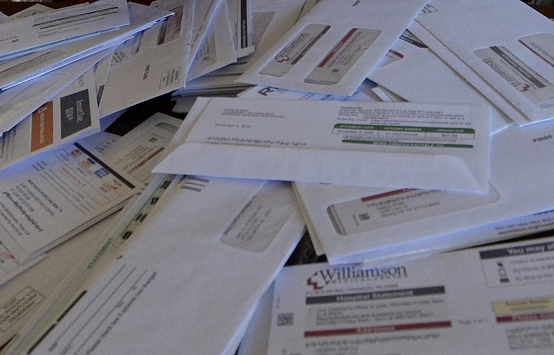 A pile of medical bills is shown in this Oct. 7, 2021, file photo. (AP/Mark Zaleski)