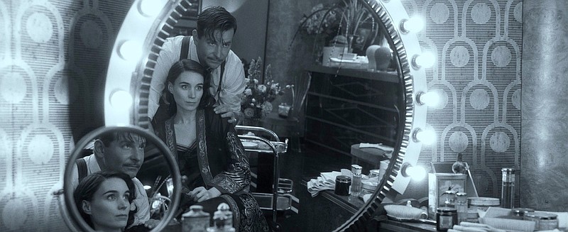 Carnies Molly Cahill (Rooney Mara) and Stanton “Stan” Carlisle (Bradley Cooper) run away from the circus and form their own social climbing act in Guillermo del Toro’s “Nightmare Alley.” A black and white version of the movie — subtitled “Vision in Darkness and Light,” is returning to theaters today.