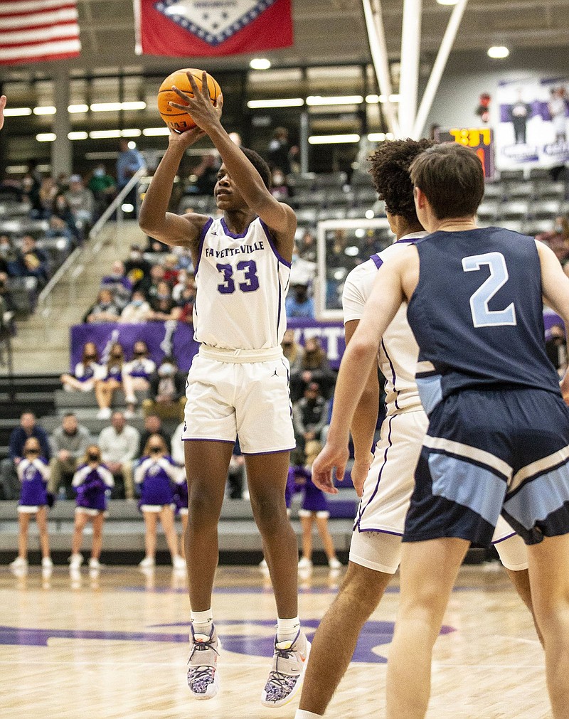 Ornette Gaines (33) of Fayetteville shoots a three-pointer Friday during the first half of the Bulldogs’ victory over Springdale Har-Ber in Fayetteville.
(Special to the NWA-Democrat-Gazette/David Beach)