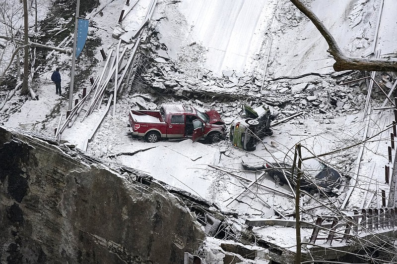 Vehicles that were on a bridge when it collapsed are visible, Friday Jan. 28, 2022, in Pittsburgh's East End. (AP/Gene J. Puskar)