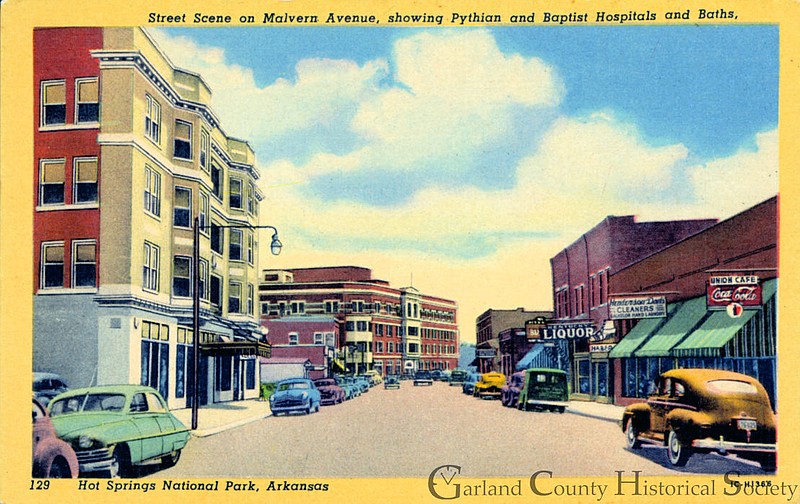 Looking south on Malvern Avenue, early 1950s. At near left is the Pythian Hotel and Bathhouse. At far left is the National Baptist Hotel (formerly Union of Woodmen) building, which now houses Home Harbor, a senior residential facility. Photo courtesy of the Garland County Historical Society