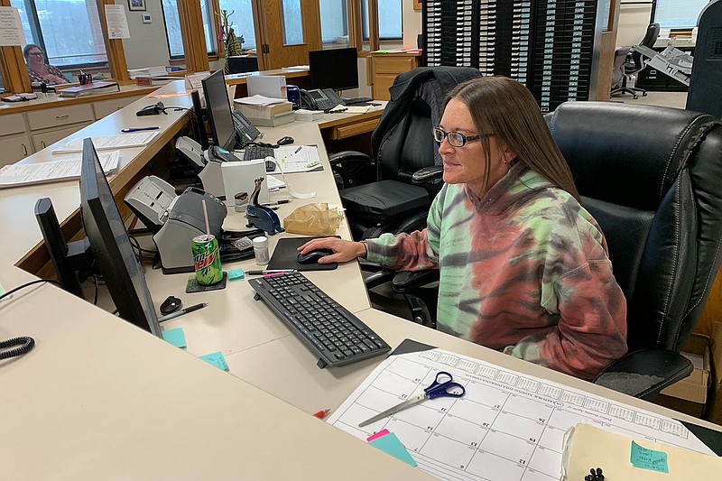 Marlena Young, a deputy clerk in the Washington County clerk’s office, works on a computer Thursday in the courthouse in Fayetteville. The office is hosting early voting for the state Senate District 7 and Fayetteville Ward 2 City Council races.
(NWA Democrat-Gazette/Andy Shupe)