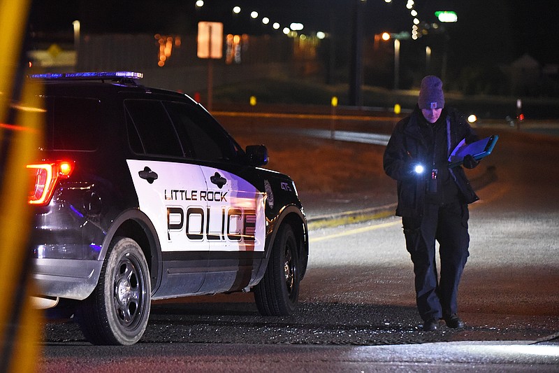 An investigator with the Little Rock Police Department looks around the scene of a homicide Jan. 28, on University Avenue near the Interstate 630 overpass. Seven homicides were reported in Pulaski County in January.
(Arkansas Democrat-Gazette/Staci Vandagriff)