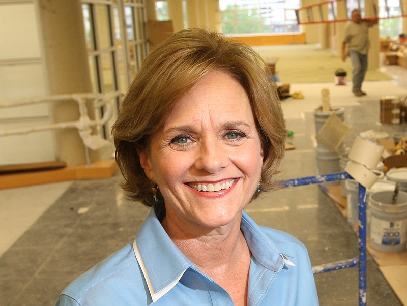 Annette Herrington poses on the then-incomplete fifth floor of Little Rock's Main Library in this October 2010 file photo. (Arkansas Democrat-Gazette file photo)