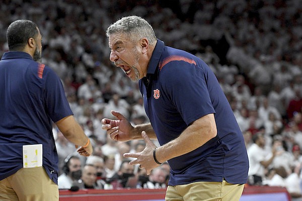 Auburn coach Bruce Pearl reacts after a charging fouled was called in favor of Arkansas during overtime in an NCAA college basketball game Tuesday, Feb. 8, 2022, in Fayetteville. (AP Photo/Michael Woods)