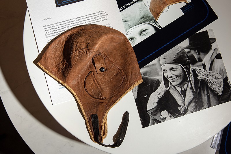 The leather aviator’s helmet that Anthony Twiggs is offering for auction is shown along with a photograph of Amelia Earhart. A professional photo-matching company concluded the helmet was Earhart’s.
(The New York Times/Shelby Tauber)