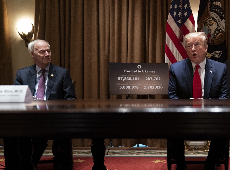 Then-President Donald Trump speaks during a meeting in the Cabinet Room of the White House as Arkansas Gov. Asa Hutchinson listens in this May 20, 2020, file photo. (AP/Evan Vucci)