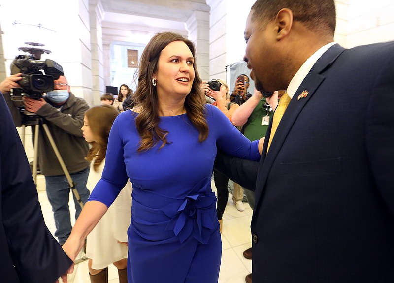 Republican gubernatorial candidate Sarah Huckabee Sanders (left) chats with with Democrat gubernatorial candidate Chris Jones (right) during the first day of candidate filing on Tuesday, Feb. 22, 2022, at the state Capitol in Little Rock. (Arkansas Democrat-Gazette/Thomas Metthe)